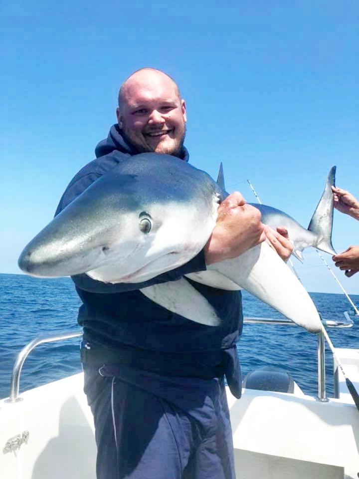  Tom Clayton with a Blue shark during the 24-hour trip