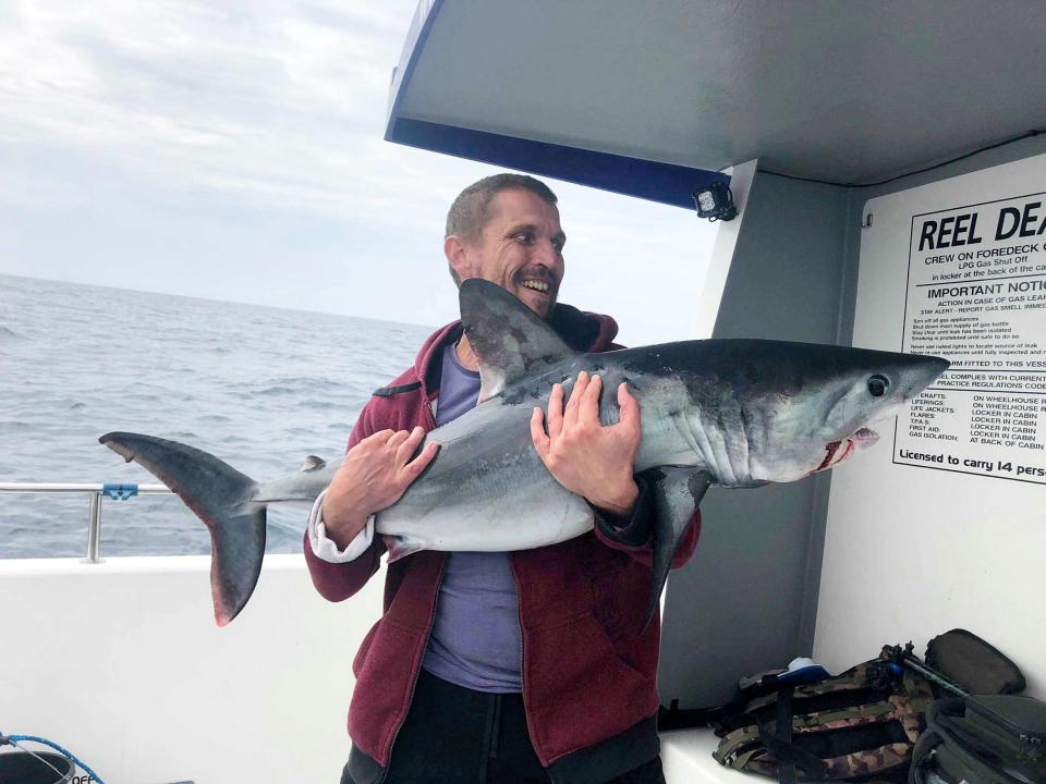  Each fisherman caught two sharks during the trip