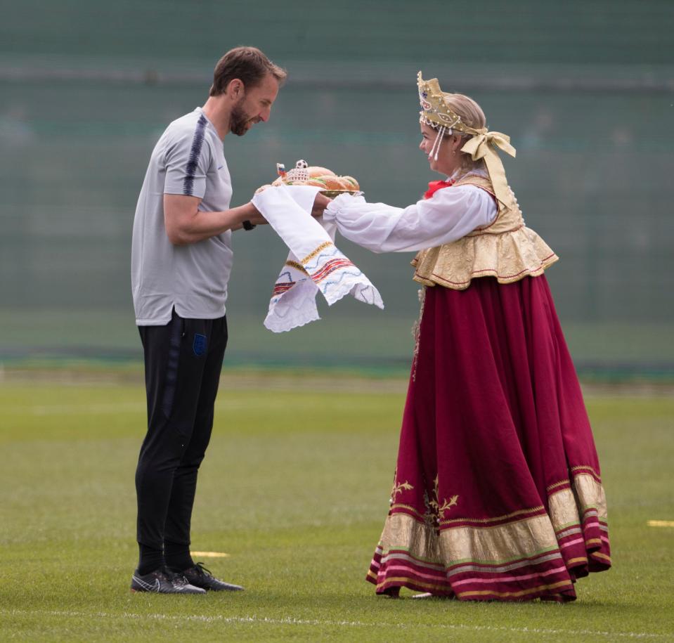  Gareth Southgate is presented with salt bread as a custom