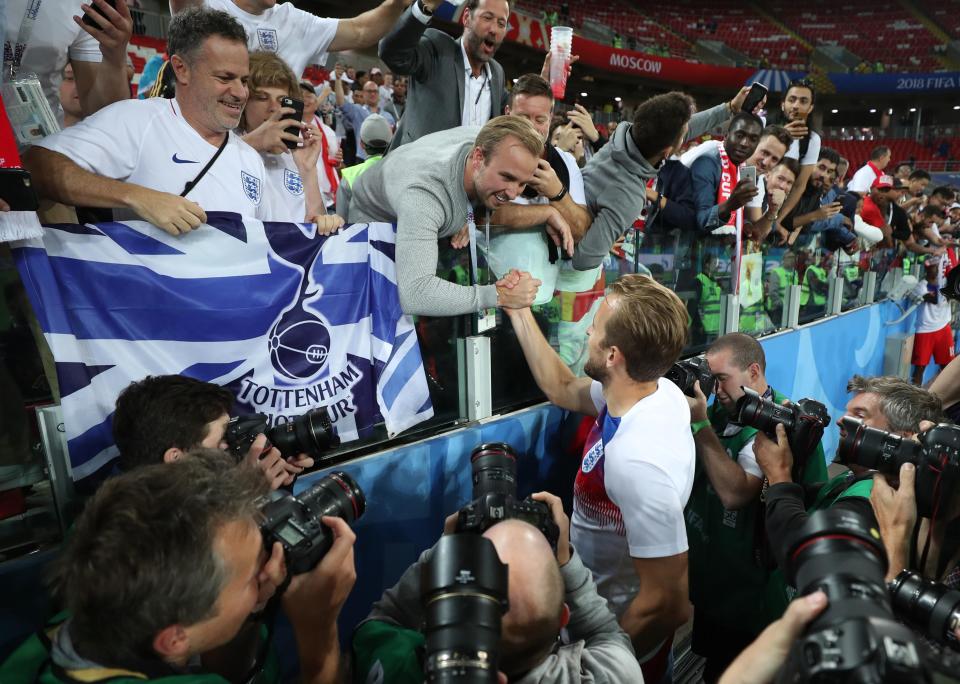  England captain Harry Kane celebrates with a fan