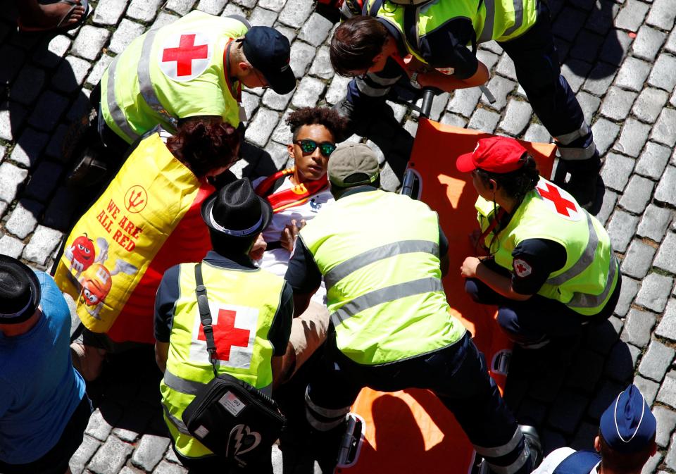  One supporter was treated by paramedics on a warm afternoon