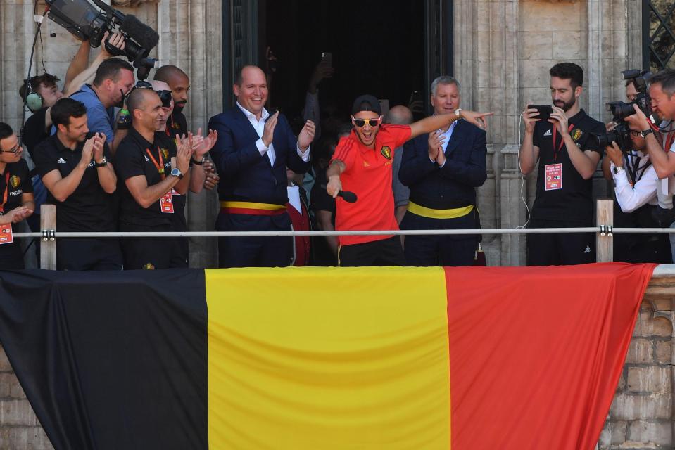  Eden hazard leads the party behind a giant Belgian flag