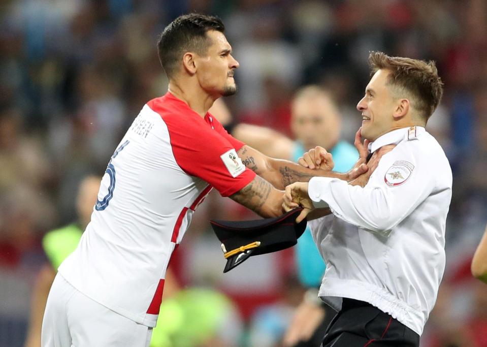  Croatia defender Dejan Lovren angrily confronts pitch invader Pyotr Verzilov