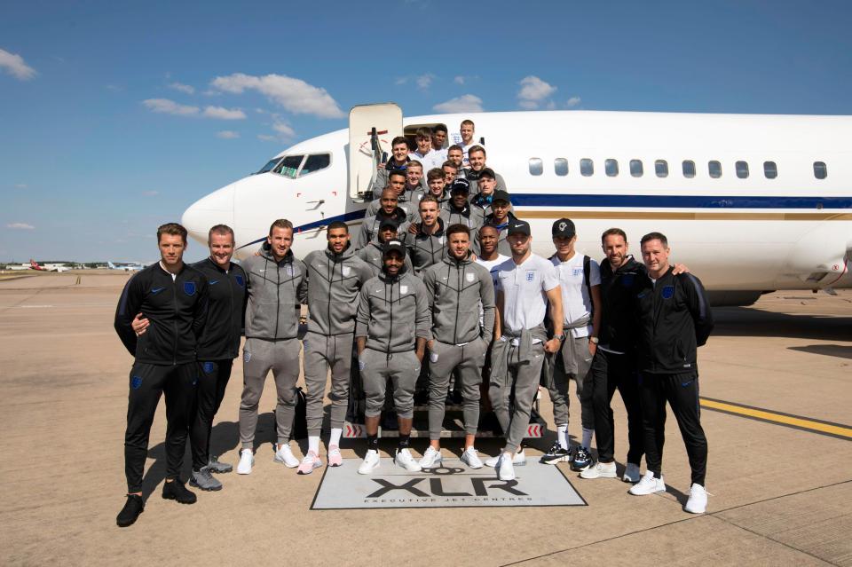  England squad pose next to plane after landing at Birmingham airport