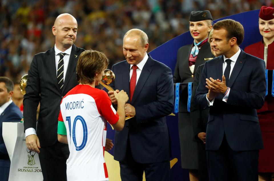  Luka Modric receives his Golden Ball award from Russia president Vladimir Putin