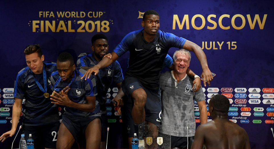  The France squad climbed on the table and danced