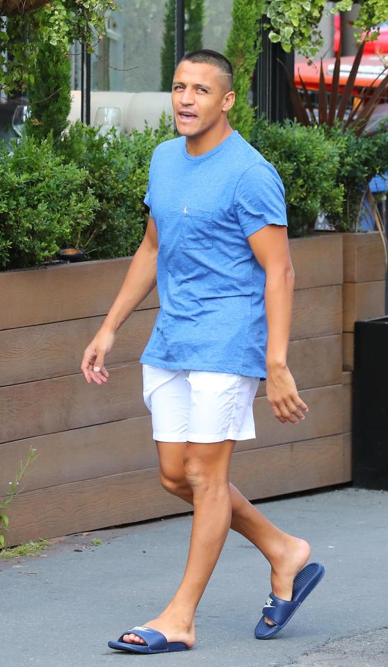  Alexis Sanchez has been spotted out and about in Wilmslow near Manchester as his team-mates flew out for their pre-season tour