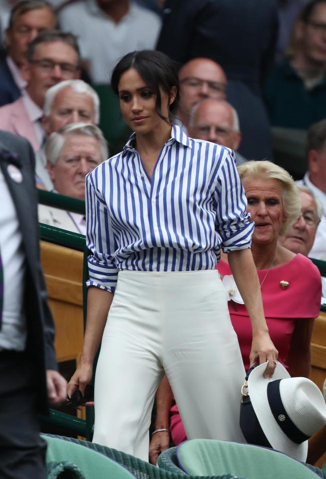  Meghan, pictured at Wimbledon, wants to make the solo trip before an official US visit next year, reports say