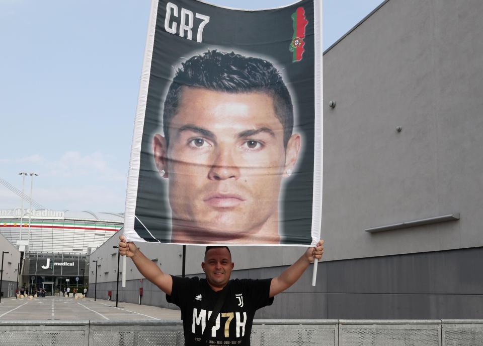  Juve fans unfurled huge banners with Cristiano Ronaldo's face on as he gets set to complete his switch from Real Madrid