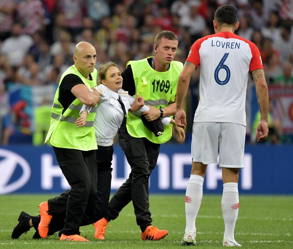  The pitch invaders dragged their feet as they were hauled off