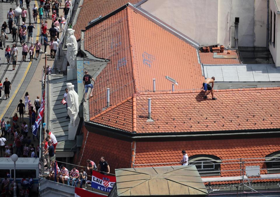  Some fans took to climbing onto their roofs to get a better view