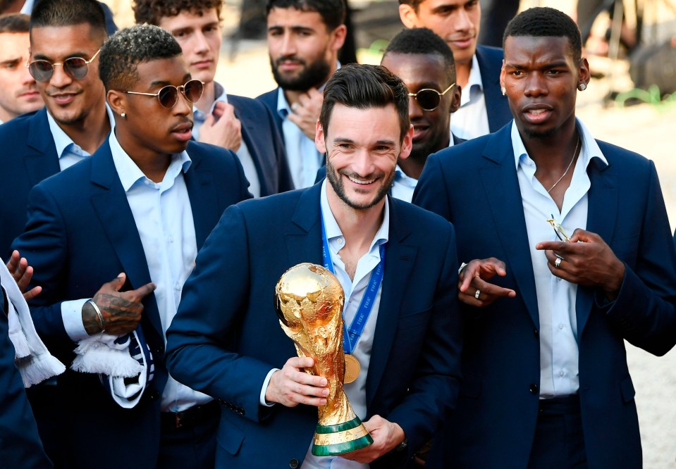 Captain Hugo Lloris kept the famous trophy close as he arrived at the palace