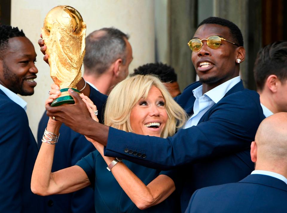  Paul Pogba lifted the trophy with Brigitte Macron