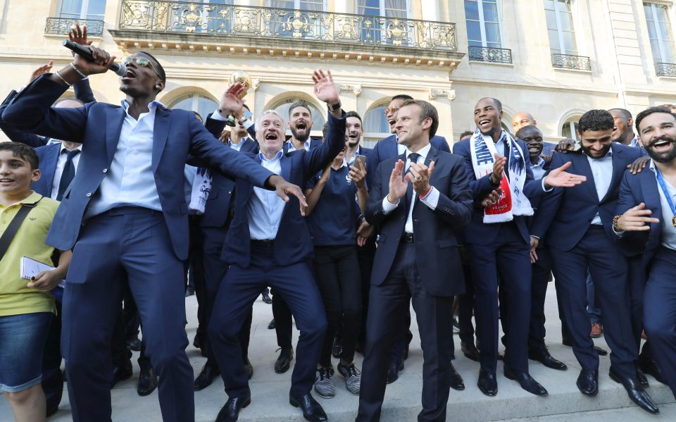  Paul Pogba, left, showed his party side too as he leads celebrations in Paris