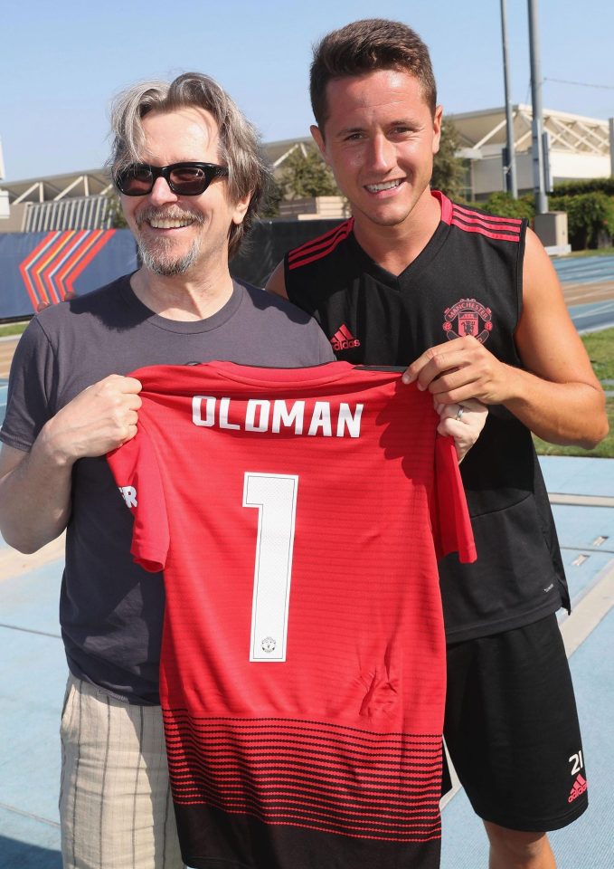  Oldman poses with his own United shirt and midfielder Ander Herrera