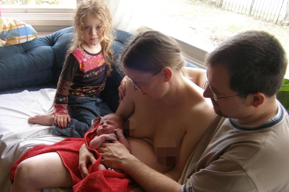  Sarah and her husband Tim pose with their children