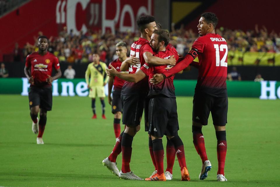  Manchester United celebrate the Spaniard's strike