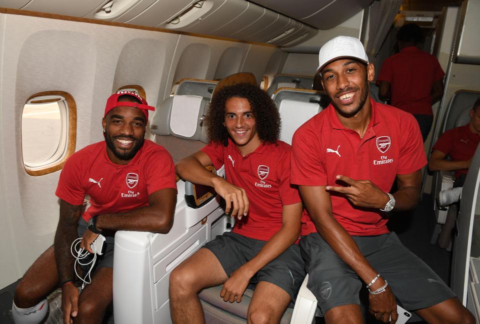  Alexandre Lacazette, Matteo Guendouzi and Pierre-Emerick Aubameyang, left to right, pose on their flight