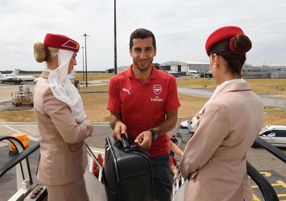  Henrikh Mkhitaryan is greeted as he prepares to board ahead of his first full season at the Emirates