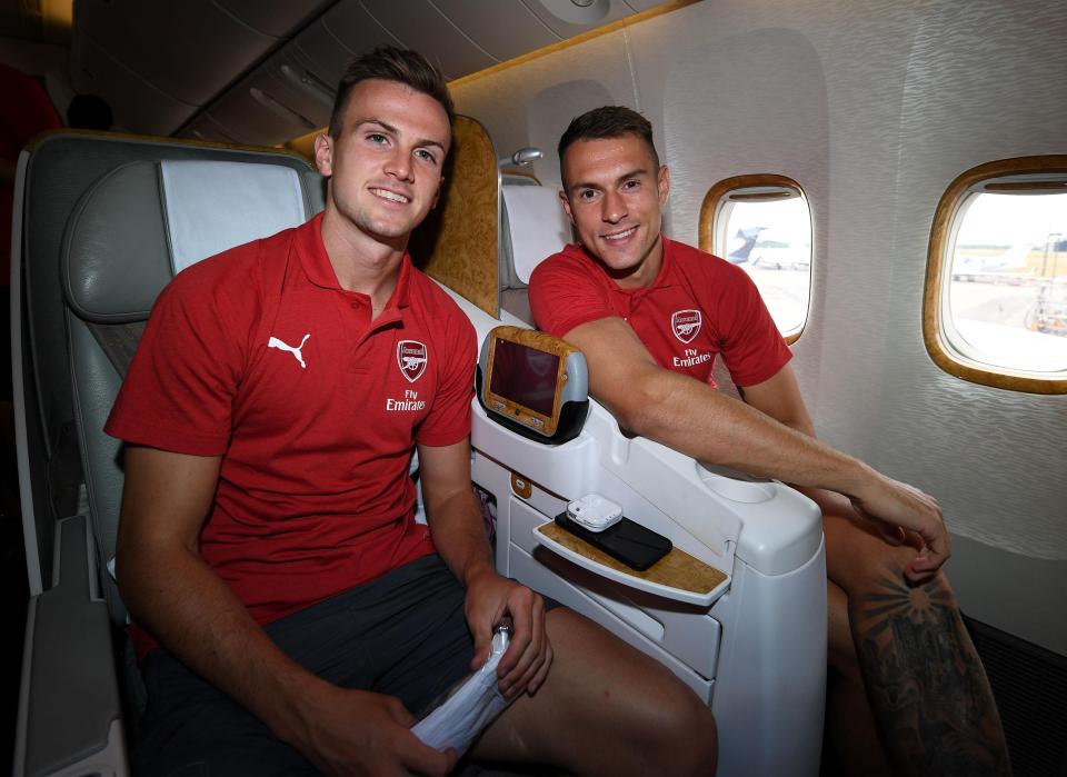  Rob Holding, left, and Aaron Ramsey get comfortable on board