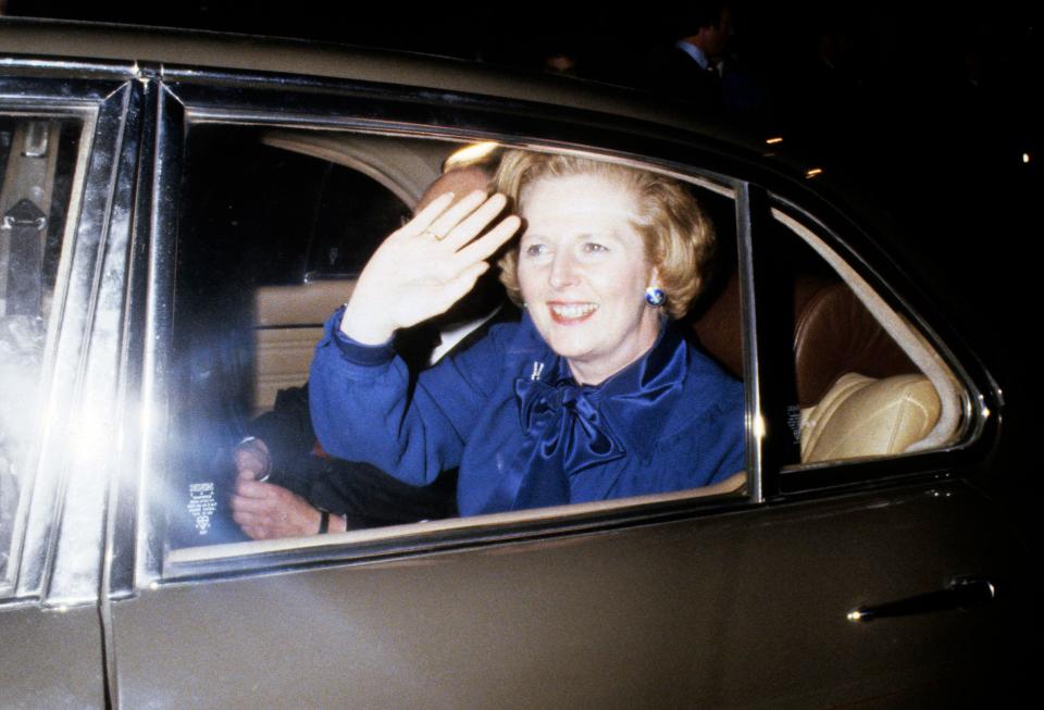  Margaret Thatcher waves from her official car where she liked to nap