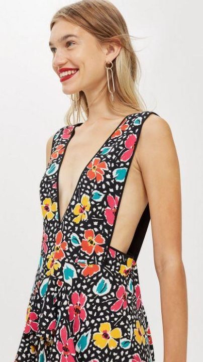  The dress features the same style, but has an 80s inspired floral print