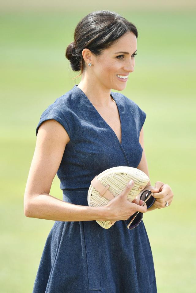  Meg teams the outfit with a J.Crew clutch bag, Tom Ford sunglasses and Birks 'bee chic' earrings