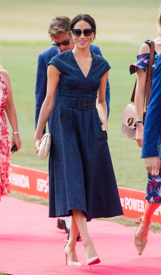  Meghan looks stunning in a £2,357 Carolina Herrera belted dress