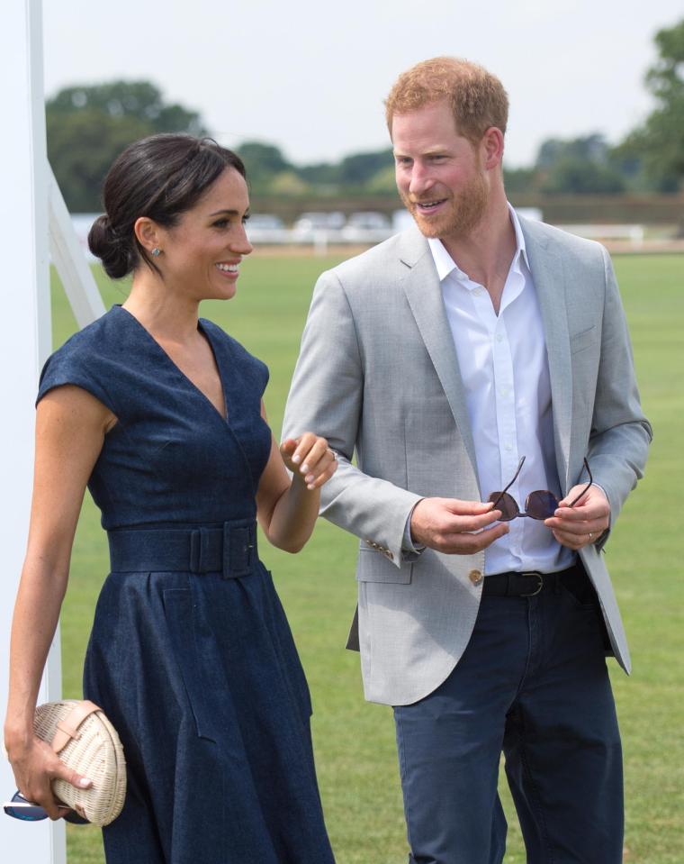  Meghan appeared relaxed and happy as she stood next to her new husband