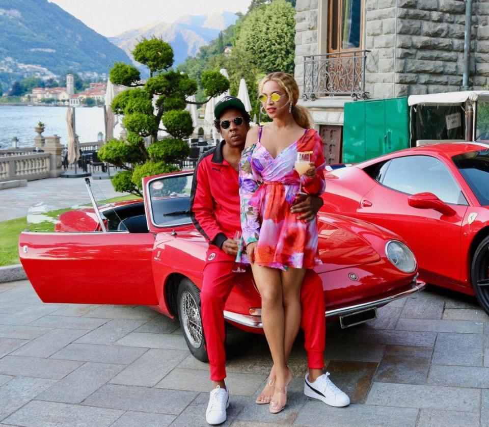  The couple posed with a sports car after venturing ashore