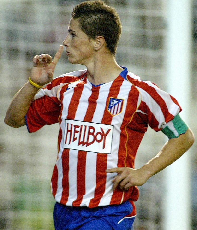  What the devil?...Atletico Madrid's Fernando Torres could be telling fans to pipe down about his shirt logo