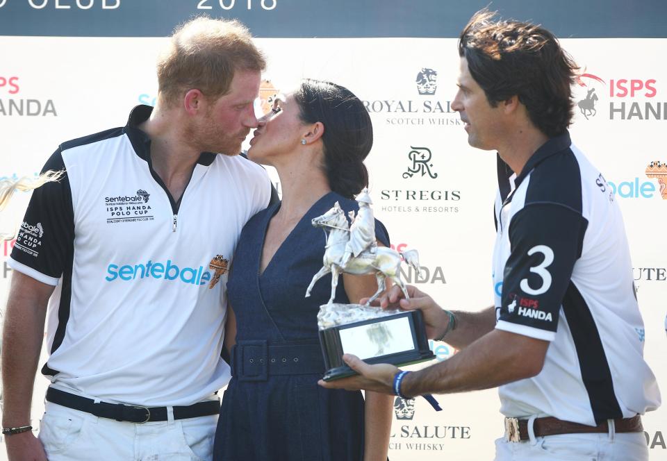  The Royals puckered up for a kiss in front of the crowd at the charity polo event