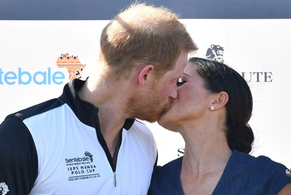  Prince Harry puckers up to Meghan Markle at the polo bash in Windsor today