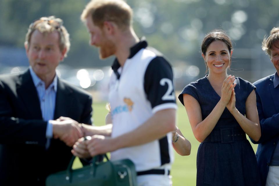  Proud Meghan leads the applause as she congratulates Prince Harry