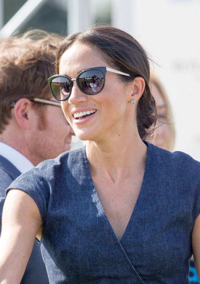  Meg teams her Sentebale polo match outfit with Tom Ford sunglasses and Birks 'bee chic' earrings