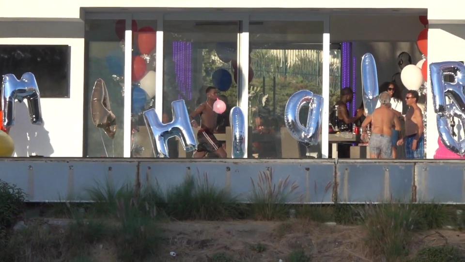  Paul Pogba parties with a balloon hanging out of his mouth