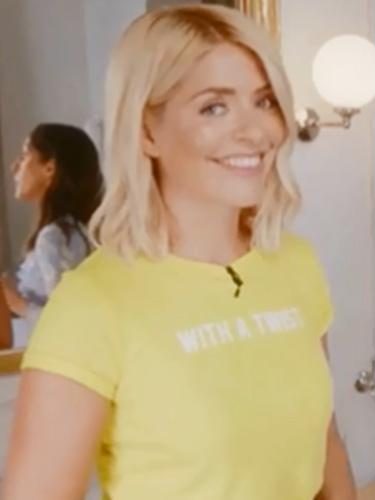  Holly looked like a ray of sunshine in this bright yellow slogan t-shirt