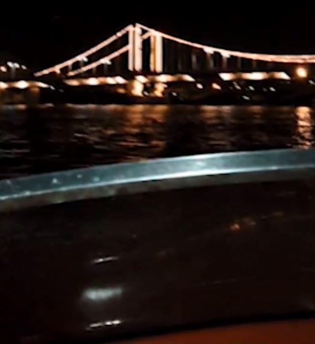 In the blurred footage, the speedboat is heard ripping through the Thames