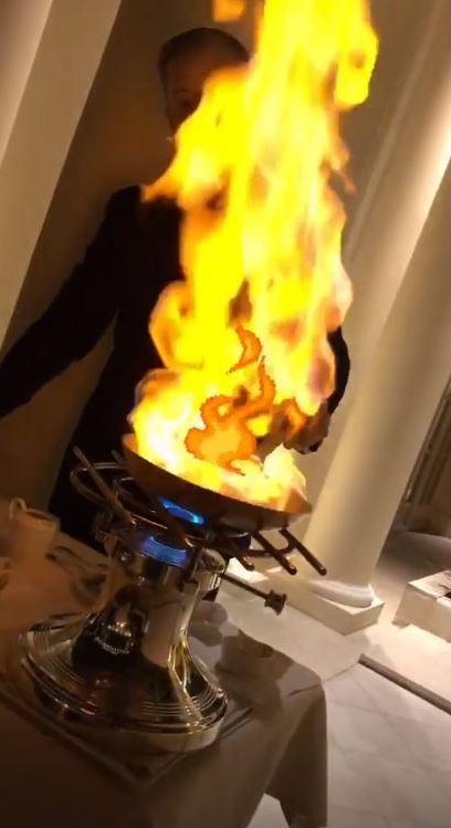  The former footie ace videoed a chef preparing a flambe dish at the table