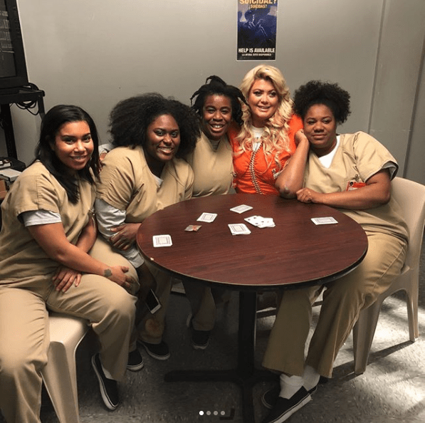  Jessica Pimmental, Danielle Brooks, Uzo Aduba, Gemma Collins and Adrienne C. Moore lean in close for a group photo on set in New York