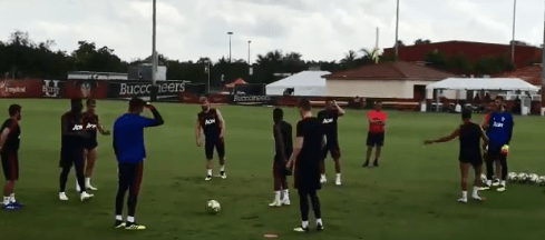  Manchester United players appear to be less than interested as they go through a one-touch warm-up routine at the start of their Miami training session