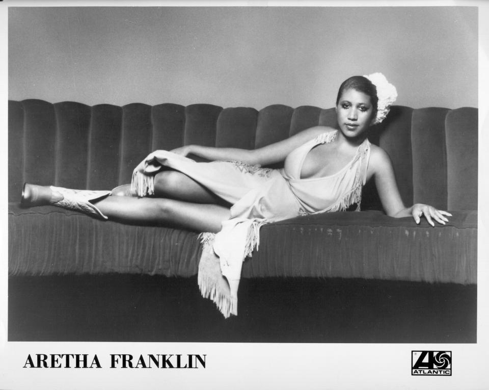  Soul singer Aretha Franklin posing for a portrait lying on a couch in 1973