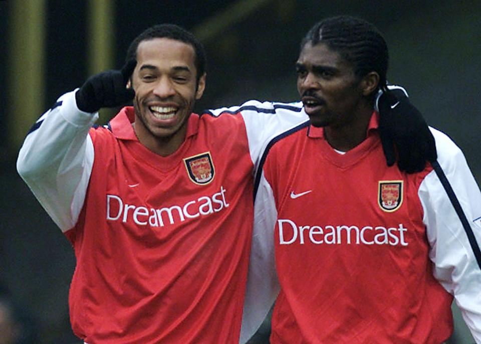  Nwankwo Kanu, right, believes Arsenal must accept Ozil or ditch him