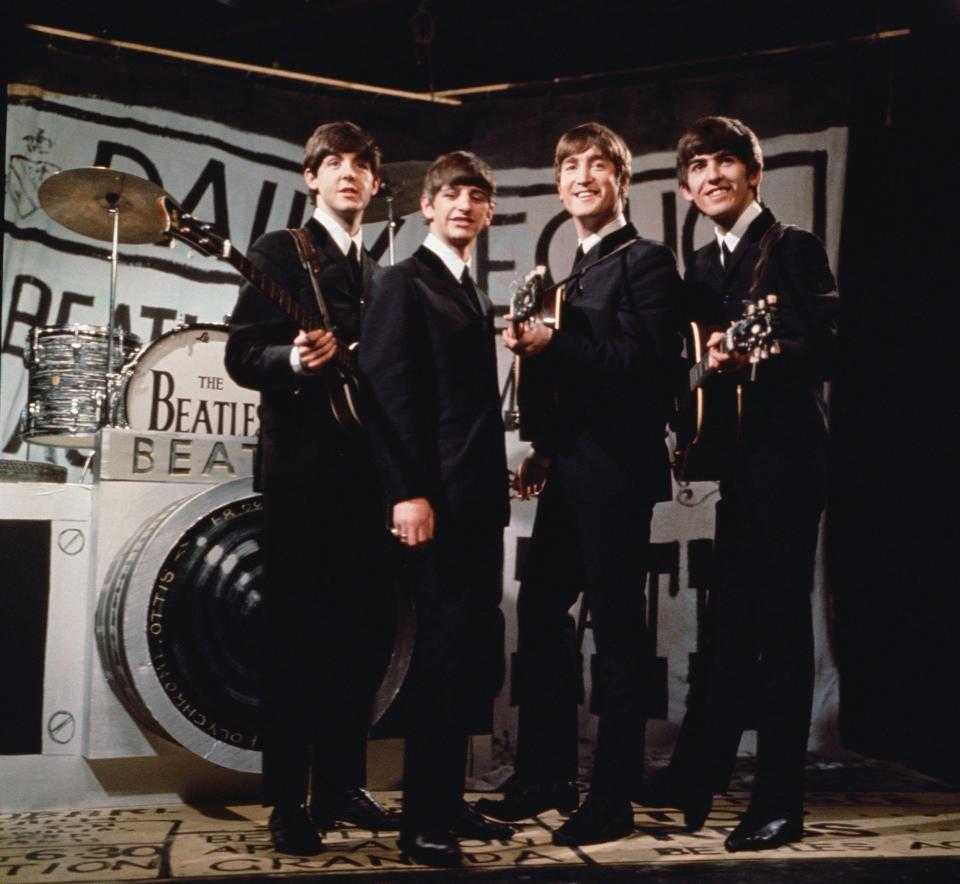  The Beatles, from left to right Paul McCartney, Ringo Starr, John Lennon (1940 - 1980), and George Harrison (1943 - 2001), performing in 1963