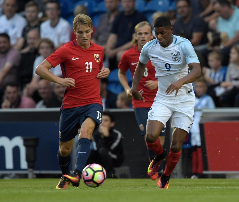  Martin Odegaard takes on Marcus Rashford for Norway's Under-21s