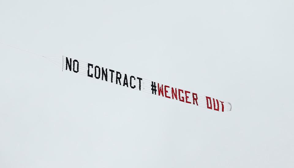  Fans flew banners above the ground before Arsene Wenger was axed