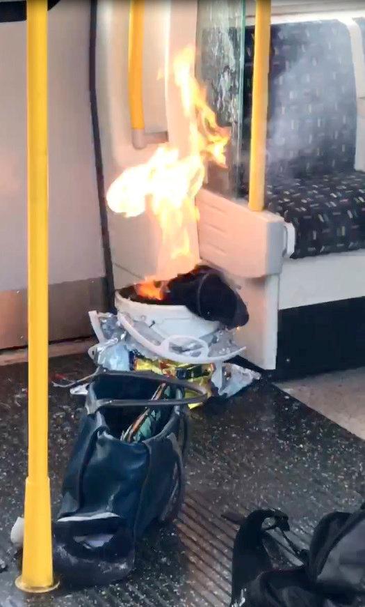  The explosive device, left by Ahmed Hassan, was seen burning on the underground train at Parsons Green tube station in London