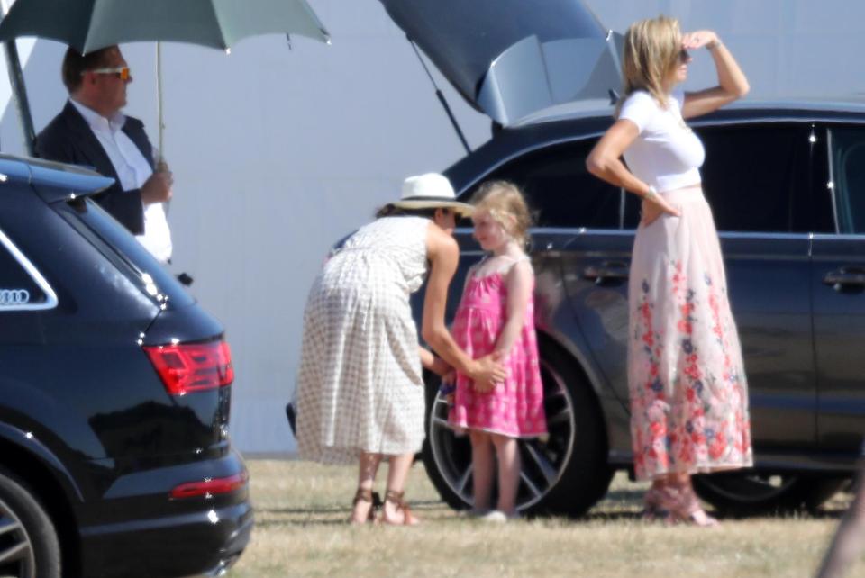  Meghan shared an adorably sweet moment with a little girl at the polo