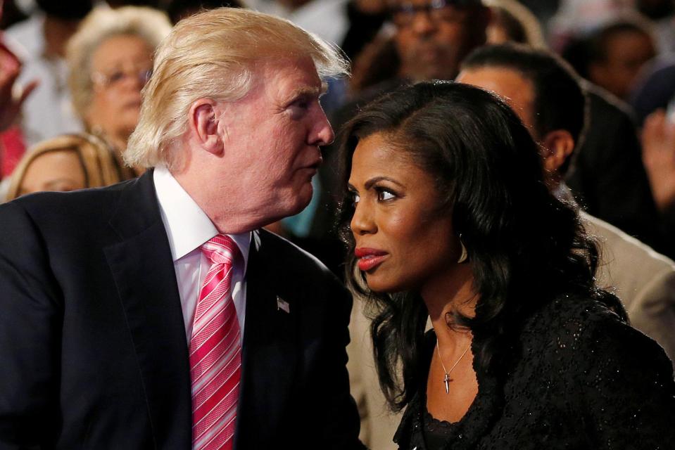  Friends then... Donald Trump and Omarosa Manigault Newman attend a church service, in Detroit, Michigan in 2016