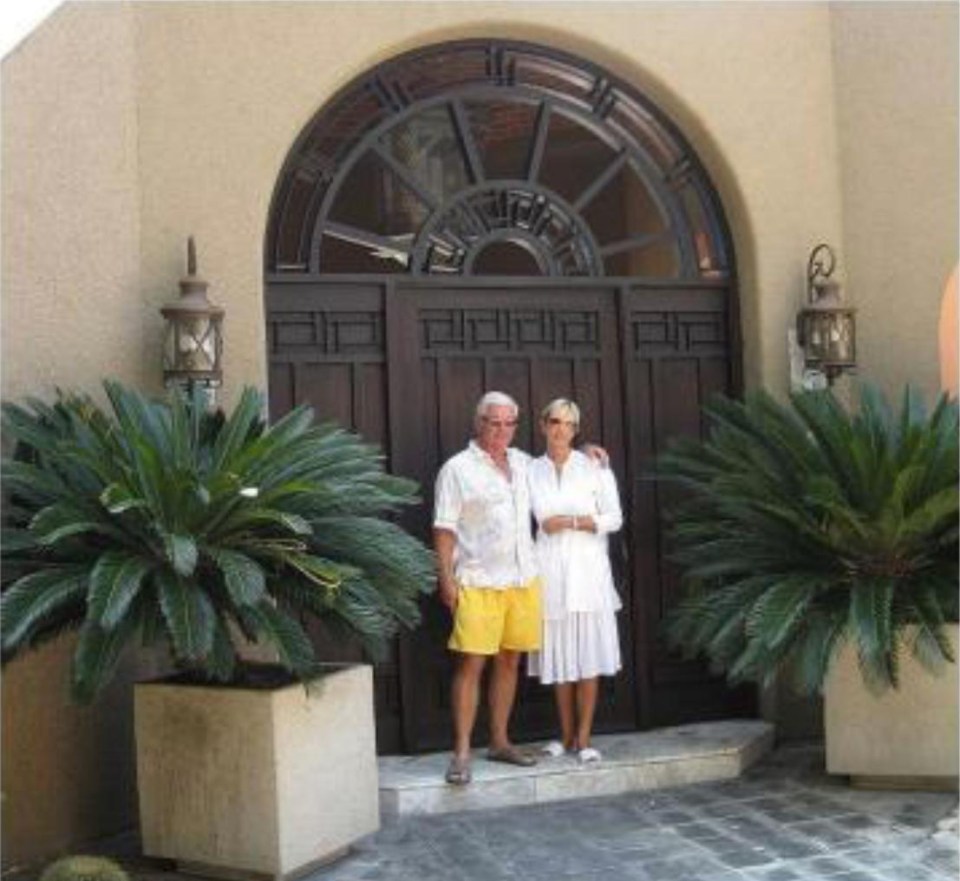 Philip with wife Sharon outside his mansion